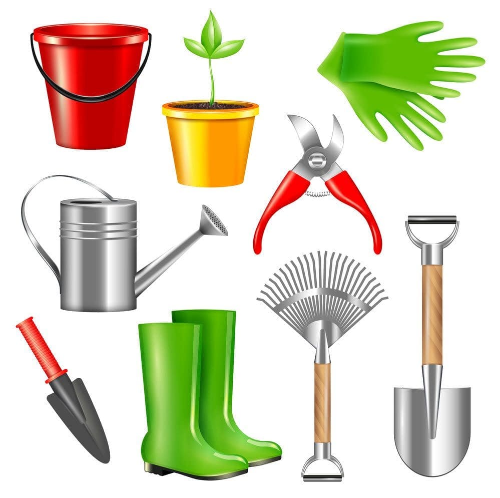An assortment of essential Garden Tools A collection of essential garden tools including a trowel, fork, and gloves laid out on wood