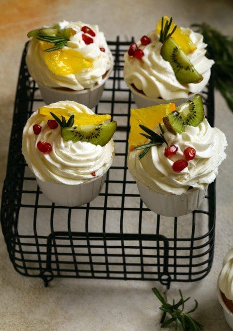 Delicious Keto Vanilla Cupcakes with Buttercream A freshly baked low-carb vanilla cupcake topped with creamy buttercream frosting