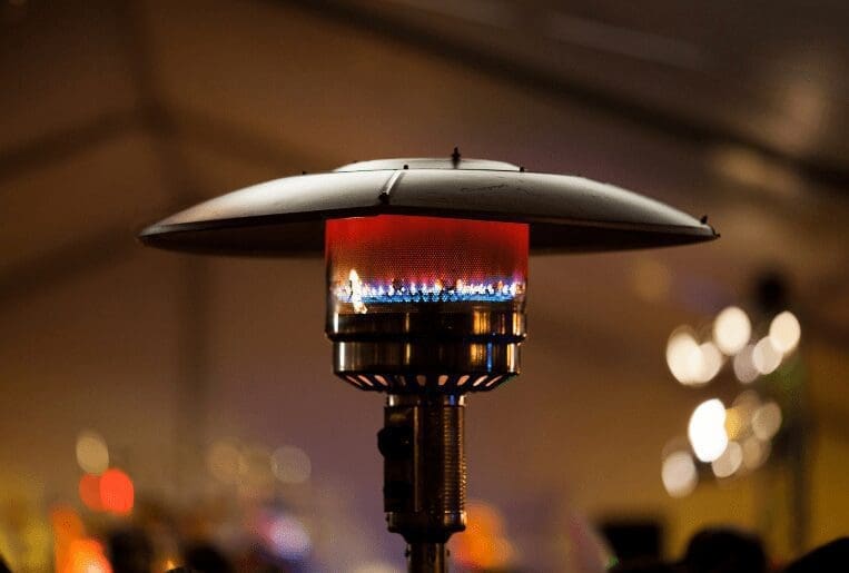 Best Patio Heater A family enjoying a warm evening outdoors under the best patio heater.