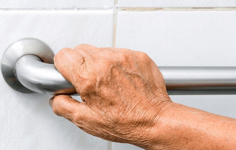 Shower Standing Handle A shower standing handle installed on a bathroom wall to improve balance and safety