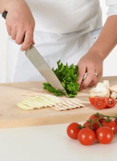 Cutting prepairing vegetables stock Cutting prepairing vegetables stock