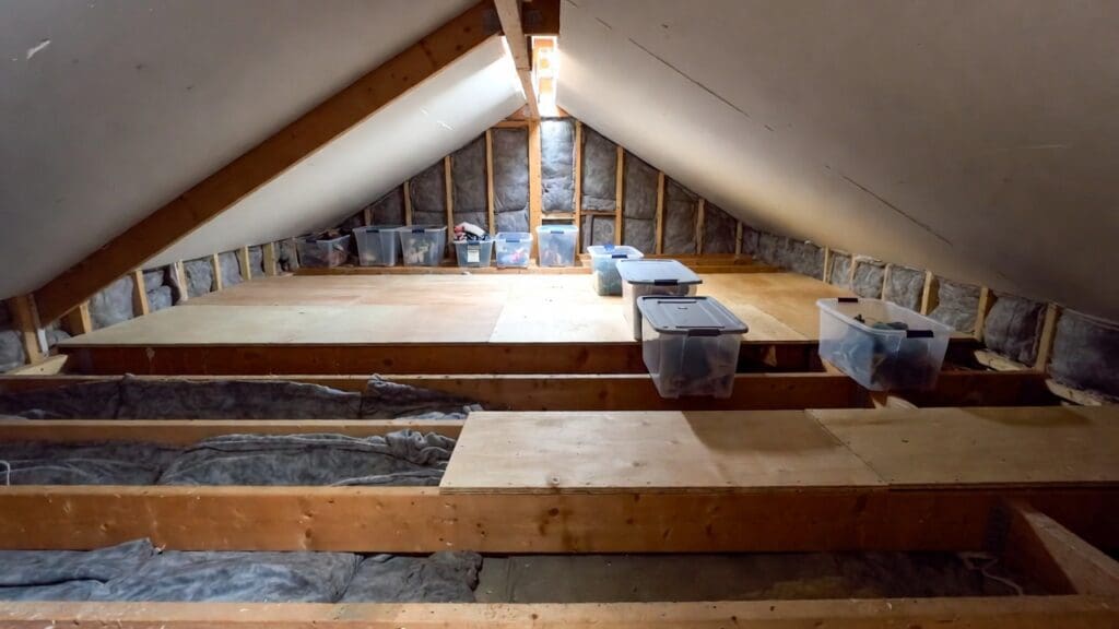 Raised attic flooring installed over insulation for safe home storage Raised attic flooring installed over insulation for safe home storage