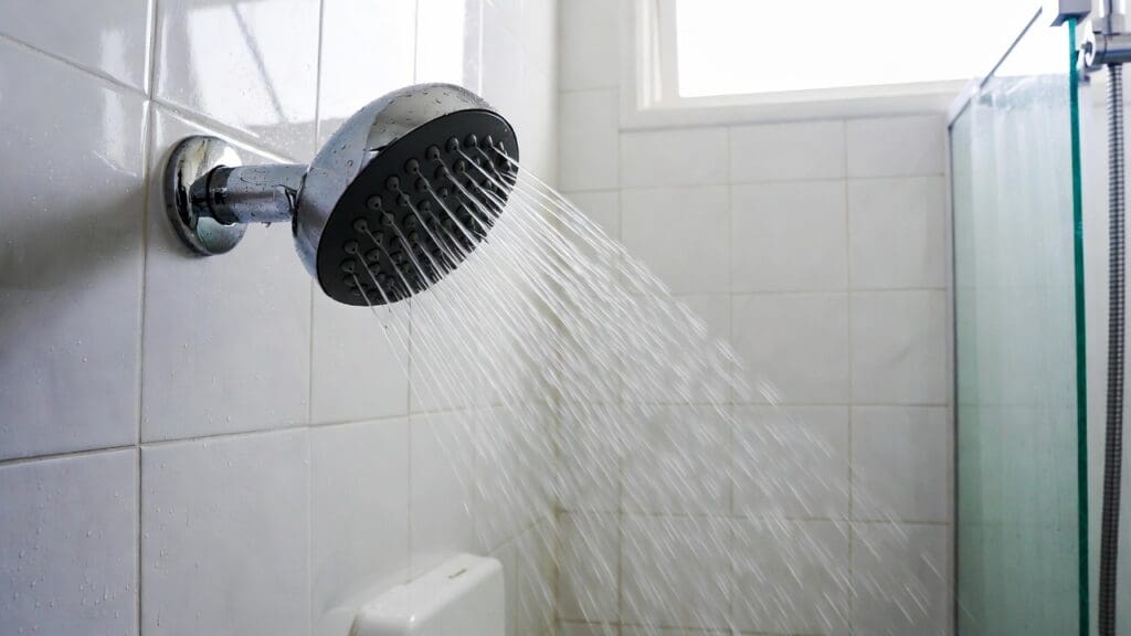 High pressure shower head spraying strong water in a modern bathroom shower Gardenfrontier High pressure shower head spraying strong water in a modern bathroom shower